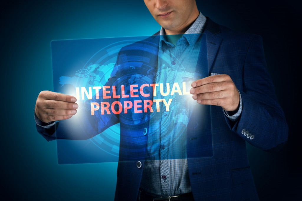 Man holding a hologram with intellectual property