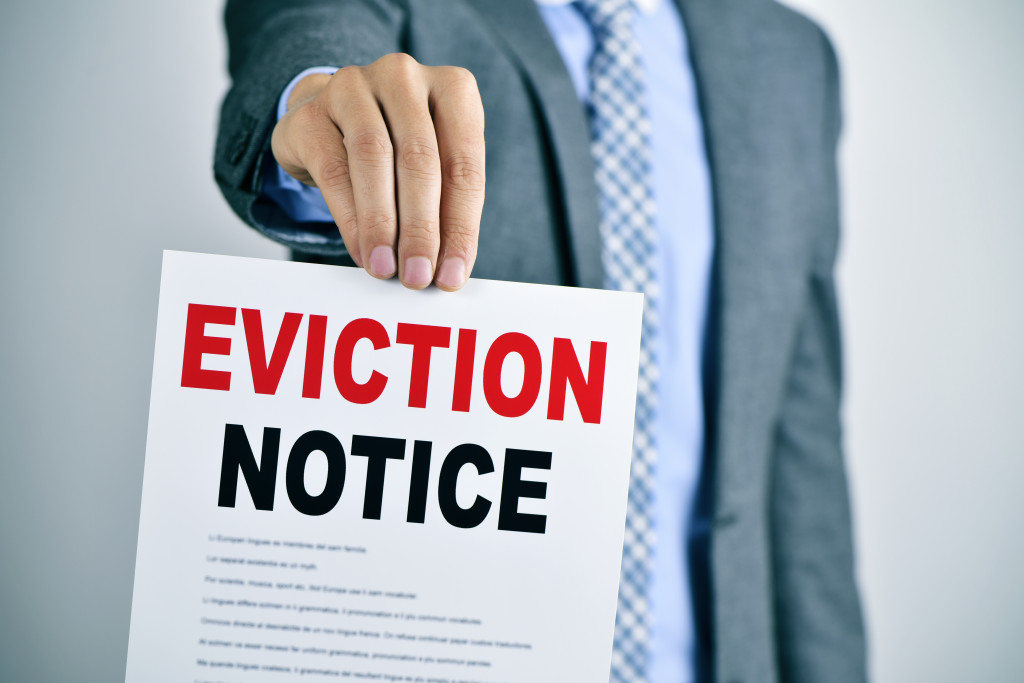 holding up an eviction notice