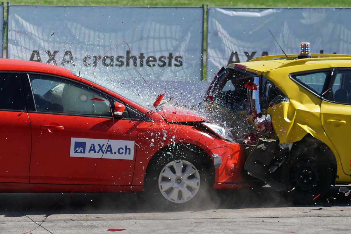 Red and Yellow Hatchback Axa Crash Tests